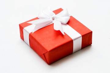 Anniversary present in a red gift box on white background. Happy relationship concept