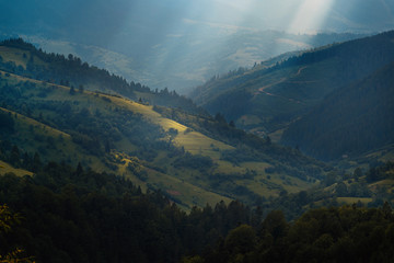 Obraz premium Mountain landscape in beautiful sunbeams.