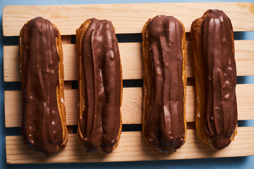 Delicious eclairs with chocolate frosting