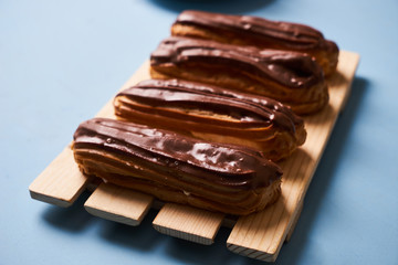 Delicious eclairs with chocolate frosting