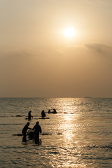 Fototapeta premium Fisherman working in morning sun at Cambodian coast