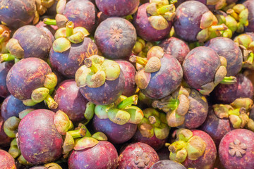 Mangosteen fruits on stand in supermarket
