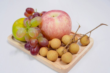 Close up of fruit on wooden tray