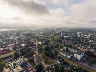 Aerial view over river Venta with a view to Ventspils panorama in Latvia. During summer time.