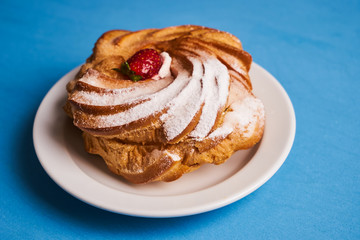 Delicious French dessert puff pastry profiteroles