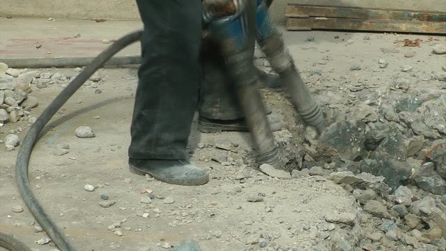 Workers to use an electric drill in the construction site
