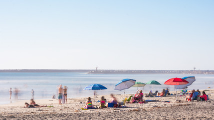 long exposure beach scene umbrellas color europe california harbor oceanside north county