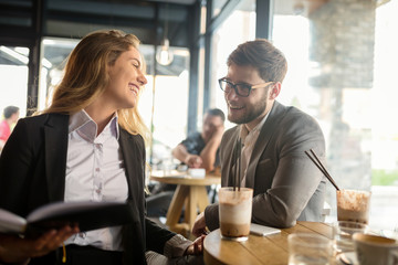Business people talking and laughing together