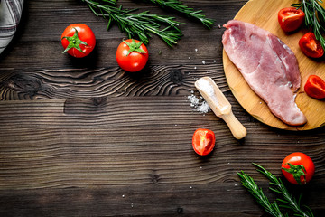 pork steak in home food concept on wooden background top view mo