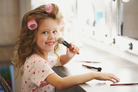 cute little girl making make-up