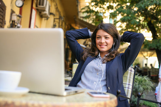 Business Woman Take A Break From Working, Using Time To Listening Music.