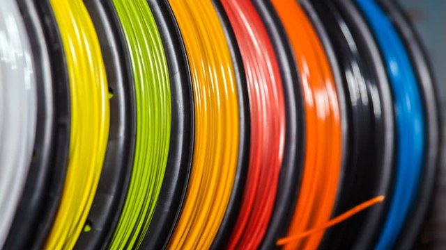 4K video footage of ABS wire plastic for 3d printer of different colors