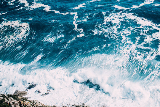 Waves splashing rocky coastline
