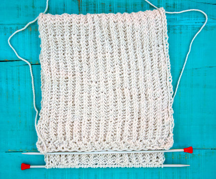 knitting scarf, knitting needles and yarn   