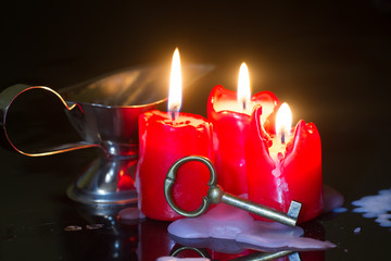 Divination and pouring wax with key and candle
