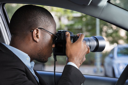 Private Detective Sitting Inside Car Photographing