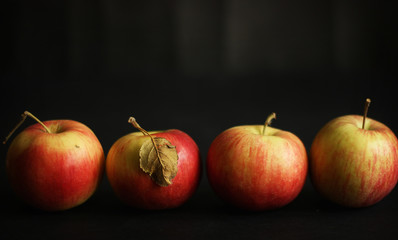 Four red apples