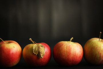 Four red apples