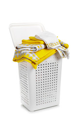 Fototapeta na wymiar White plastic laundry basket with towel isolated on white background