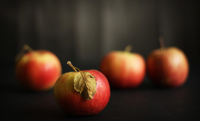 Four red apples