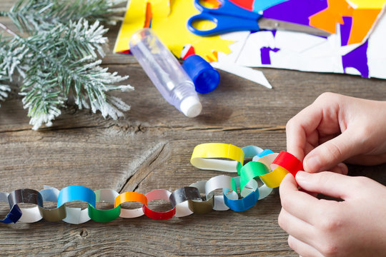 Making Christmas Paper Chains By Kid 
