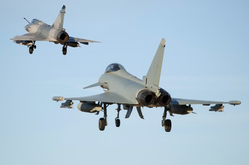 Formation of fighter planes landing