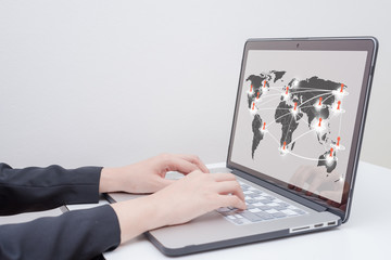 business woman use computer with "social network concept on world map" presentation