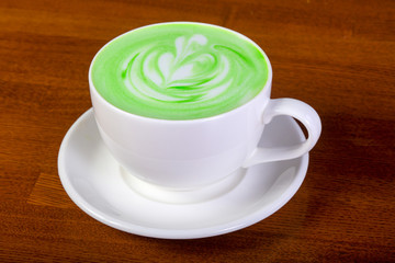 Green cappuccino with cream