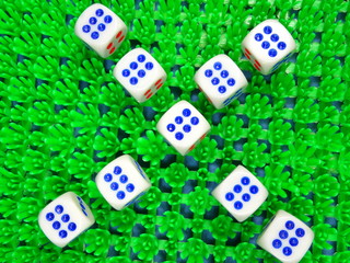 Dice on green background