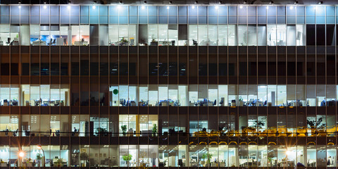 Large office building windows at night