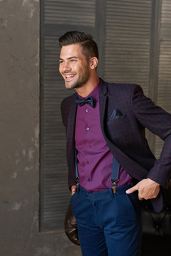 Man model in dark jacket purple shirt and blue trousers Stock Photo Adobe Stock