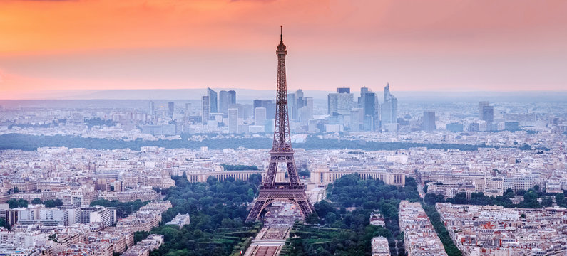 Paris, France. Panoramic View Of Paris Skyline With Eiffel Tower In The Center. Amazing Sunset Scenery With Dramatic Sky.