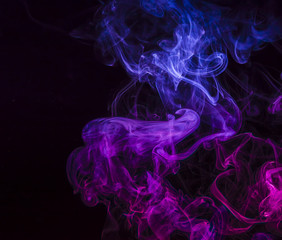 Colored smoke on black background