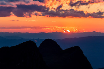 Sunset scene with silhouette mountain at Doi Luang Chiang Dao, Chiang Mai Province, Thailand