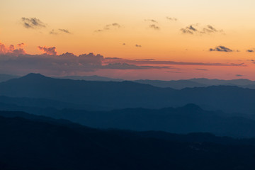 Fototapeta premium Sunset scene with silhouette mountain at Doi Luang Chiang Dao, Chiang Mai Province, Thailand