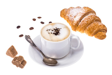 Fresh croissant and cappuccino on white background
