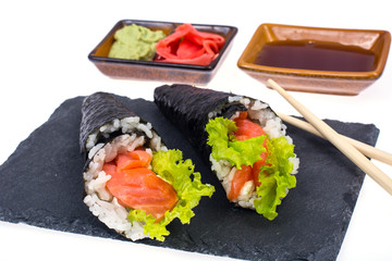 Tasty fresh sushi cone on black stone