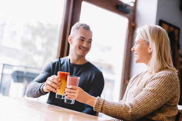 Young couple with a drink spending time together.