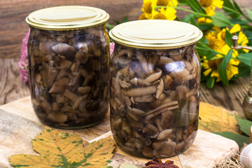 Home made cans. Glass jars with pickled mushrooms