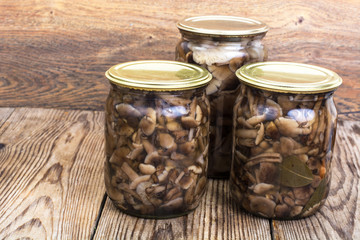 Home made cans. Glass jars with pickled mushrooms