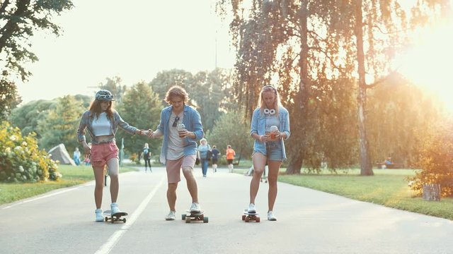 Young skateboarders in the summer park