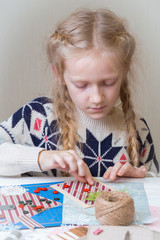 little girl make a New Year's card