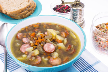 Dish from lentils, vegetables and sausages
