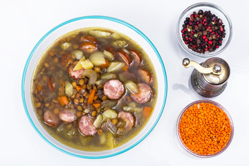 Dish from lentils, vegetables and sausages