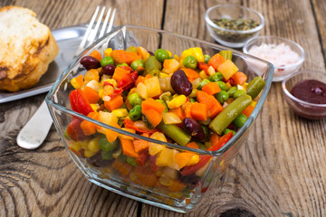Vegetable dish with red beans in glass bowl