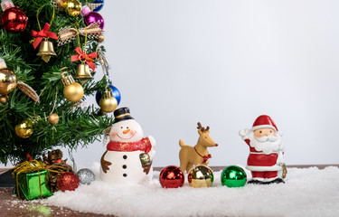 Christmas decoration Holiday or new year with Santa Claus and snowman on snow background and copy space