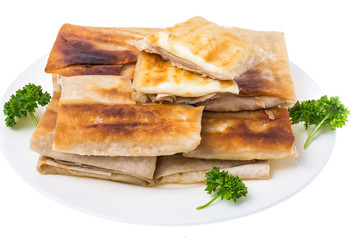 Grilled pita bread with cheese filling, close up,delicious and hearty breakfast