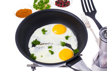 Two fried eggs on Teflon frying pan