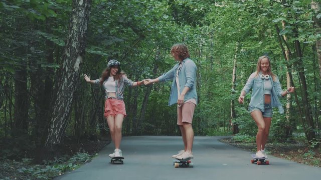 Teenagers skateboarding outdoors
