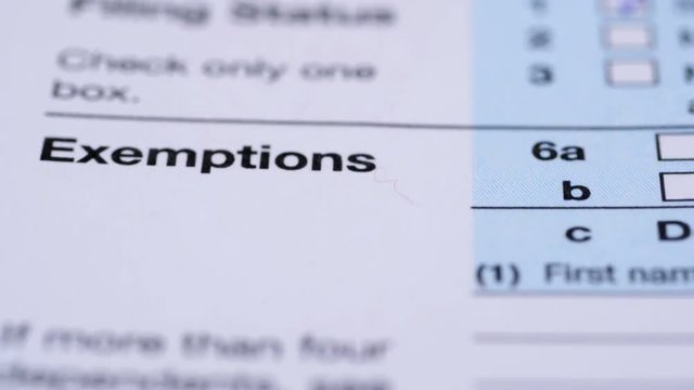 Tax form 1040. Dolly shot. Extrem close-up view.
